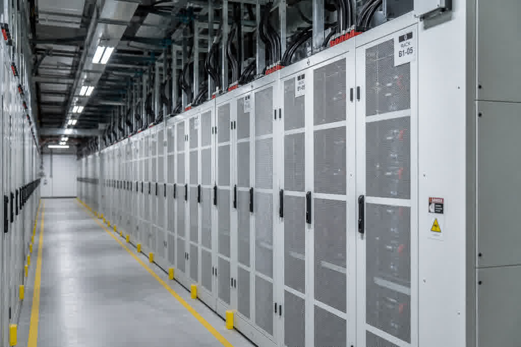 Battery formation cycling racks in a manufacturing room