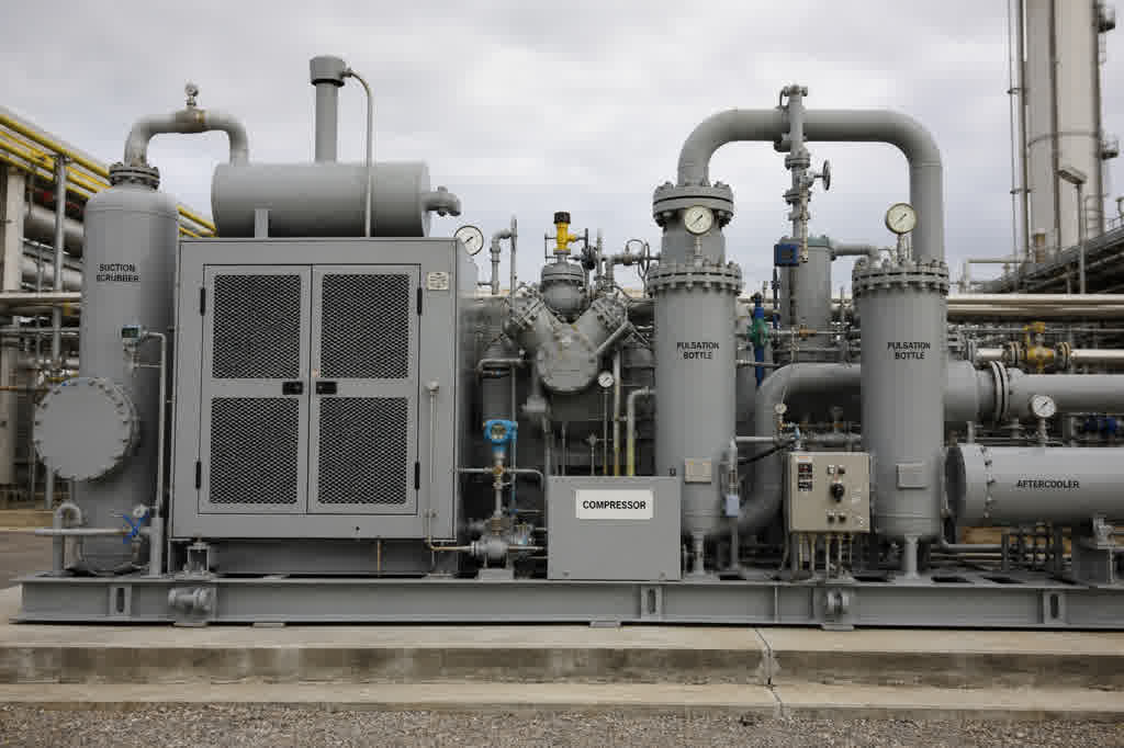 Reciprocating compressor in an oil and gas facility